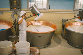 a person washing a sink