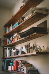 a shelf with books and other objects on it