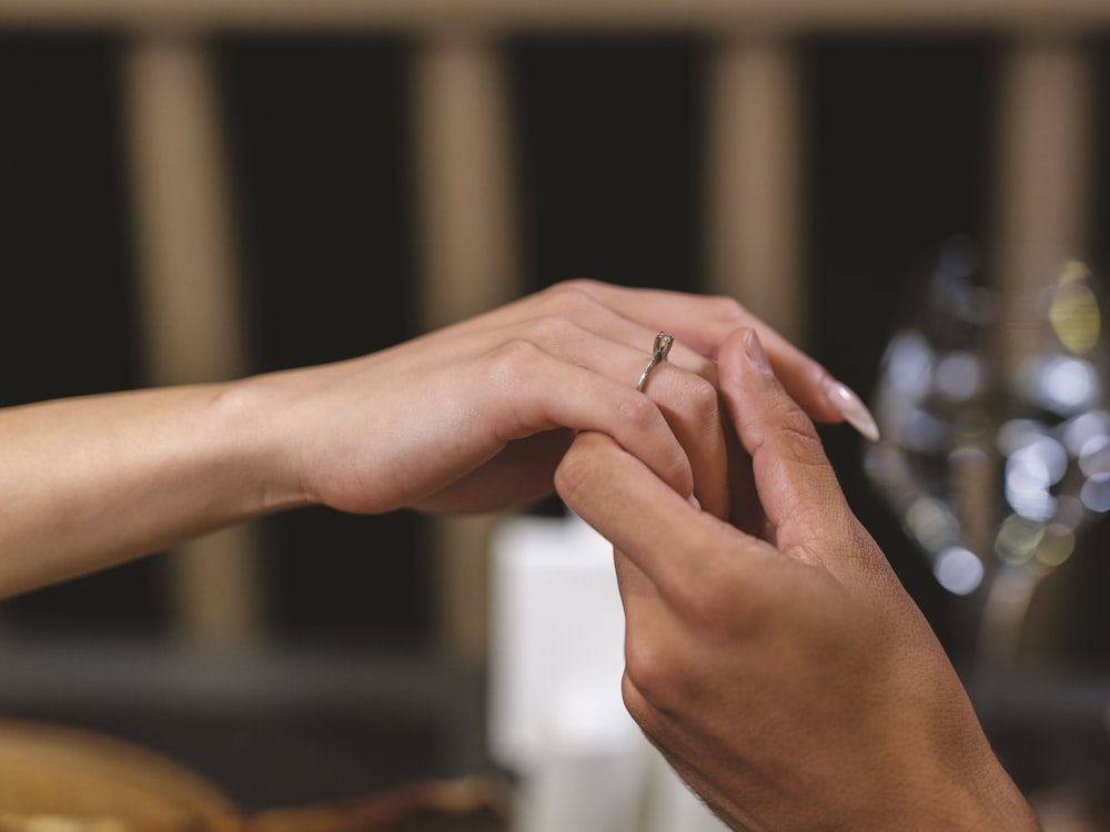 a close-up of hands holding each other