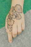 a hand with a tattoo on it