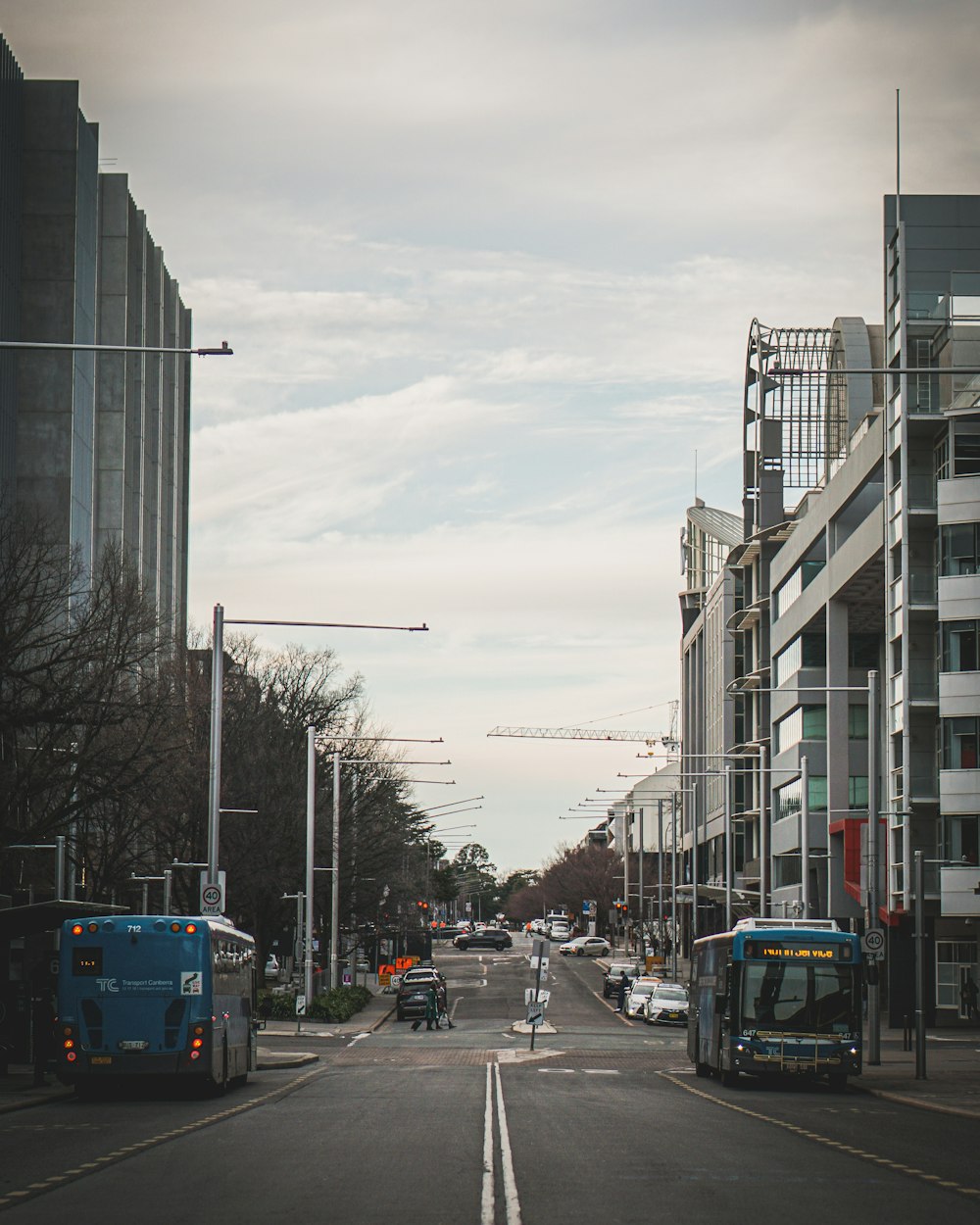 a city street with buses and cars