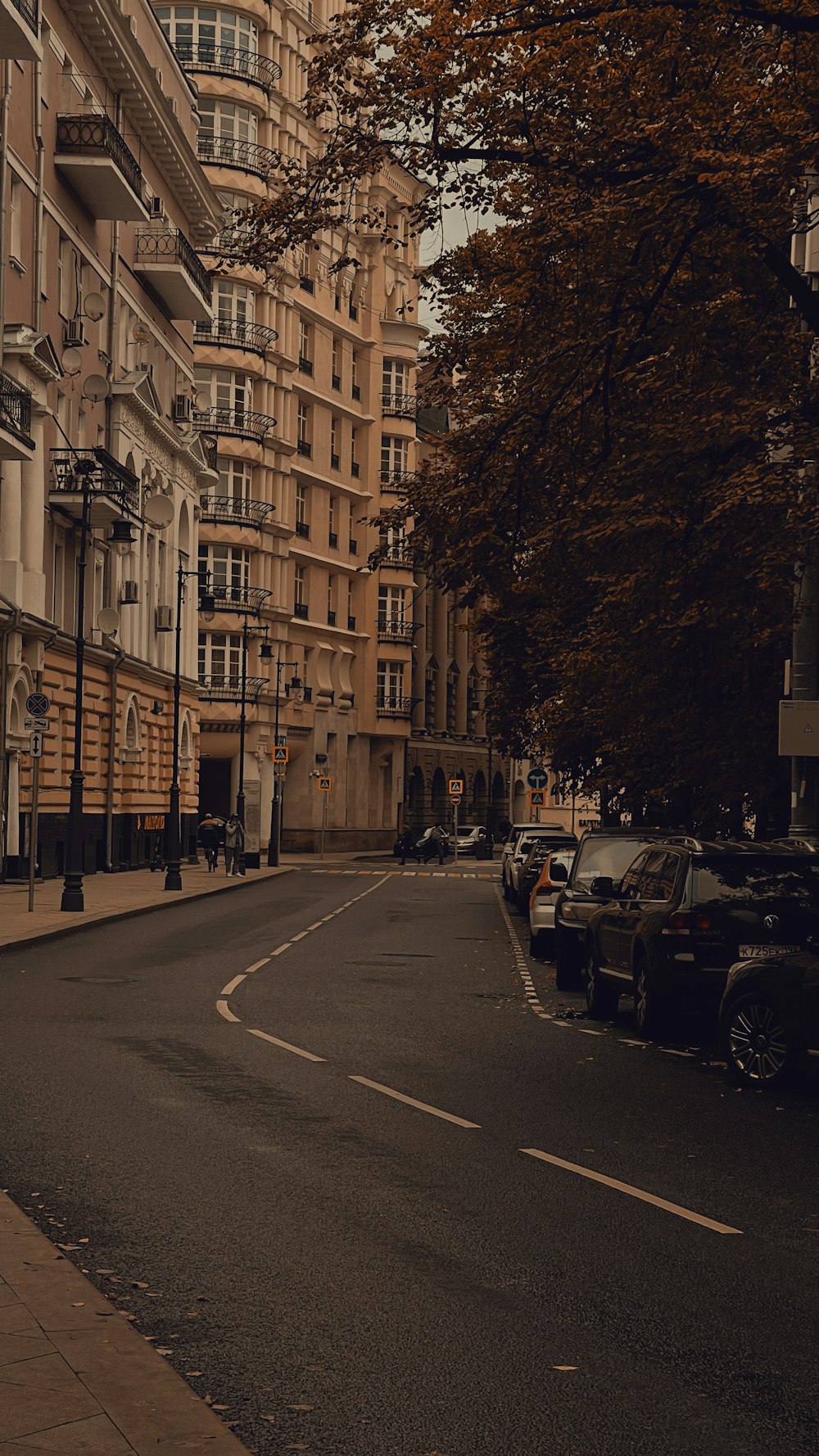 a street with cars parked on the side