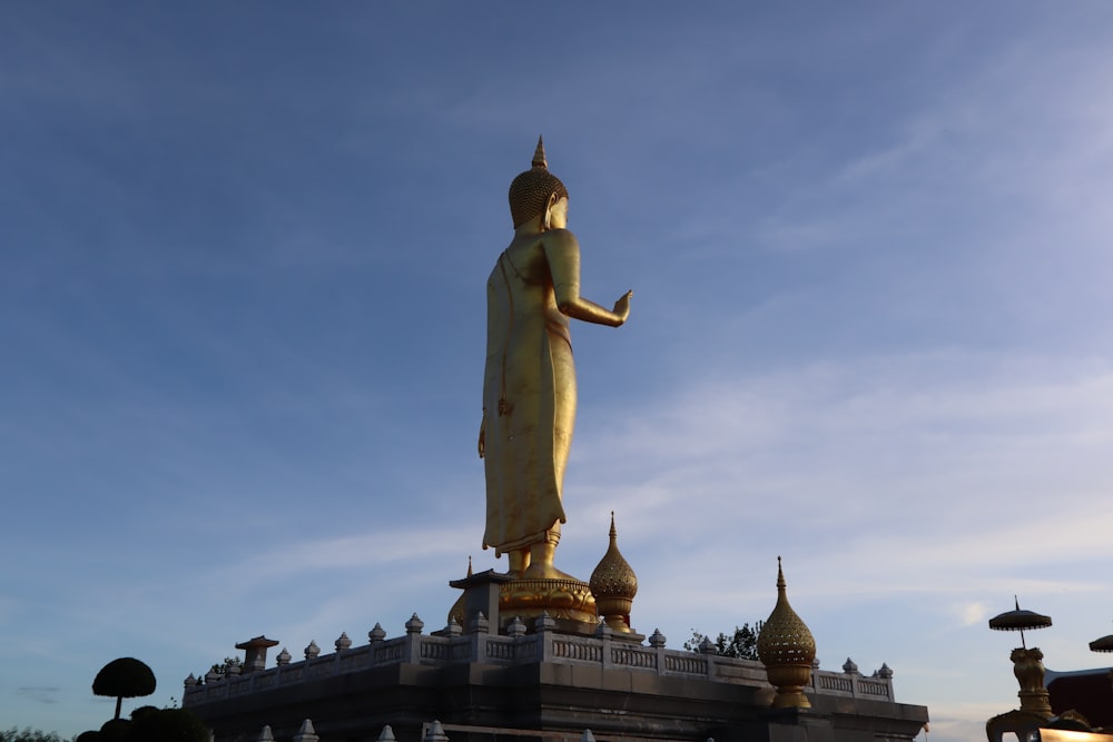 a large statue of a person holding a torch