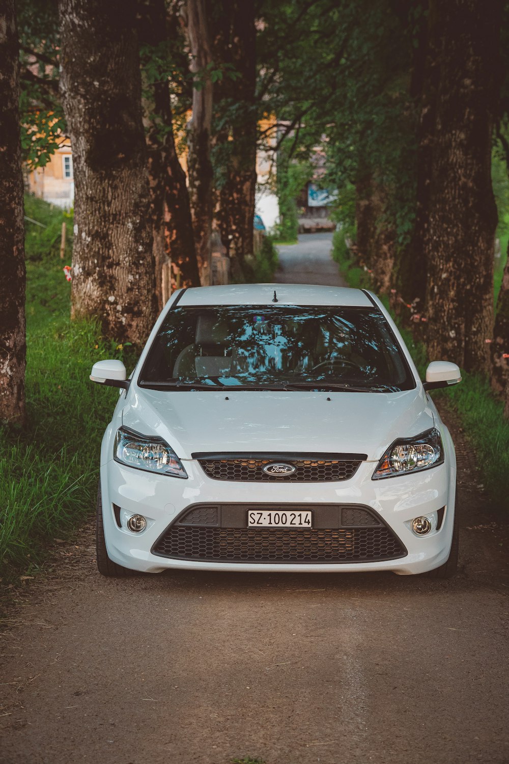 a white car parked on a road