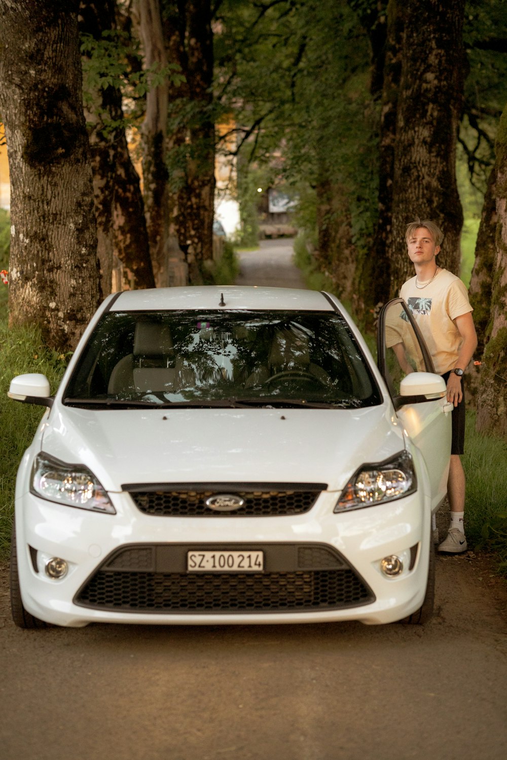 a person standing next to a car