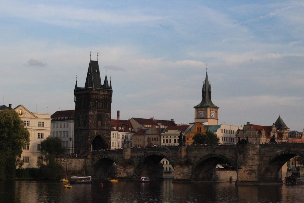 a bridge over a river with buildings on either side of it