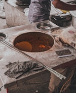 A live counter chef preparing fresh tandoori kebabs at a wedding event