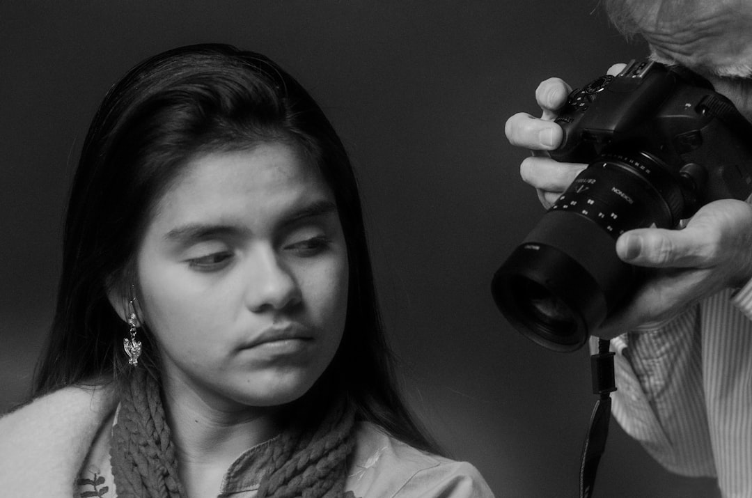 a woman holding a camera, Portrait studio emotion face to cameras