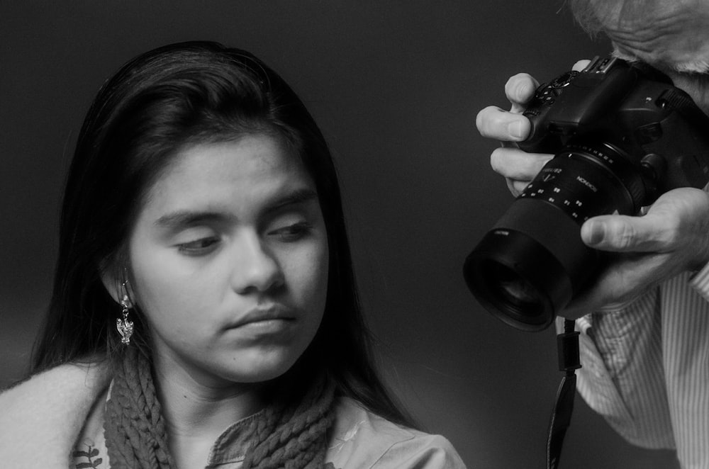 a woman holding a camera