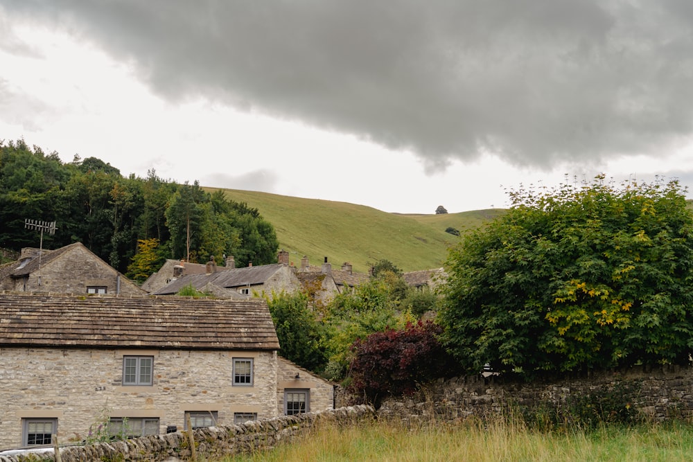 a building with a hill in the background