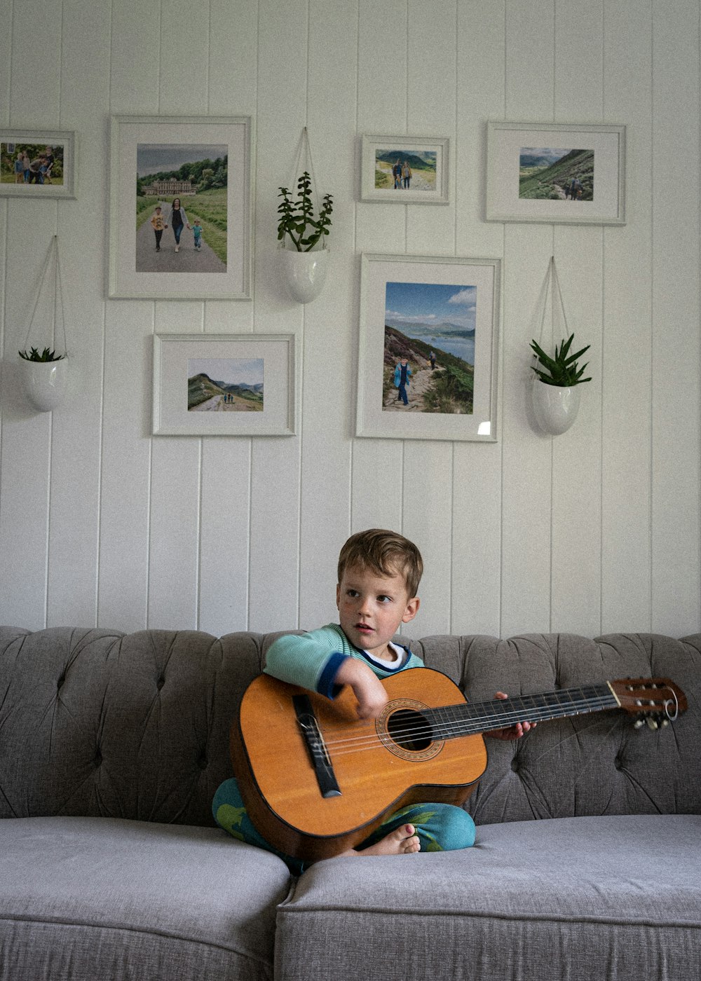 a boy playing a guitar