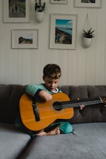 a boy playing a guitar