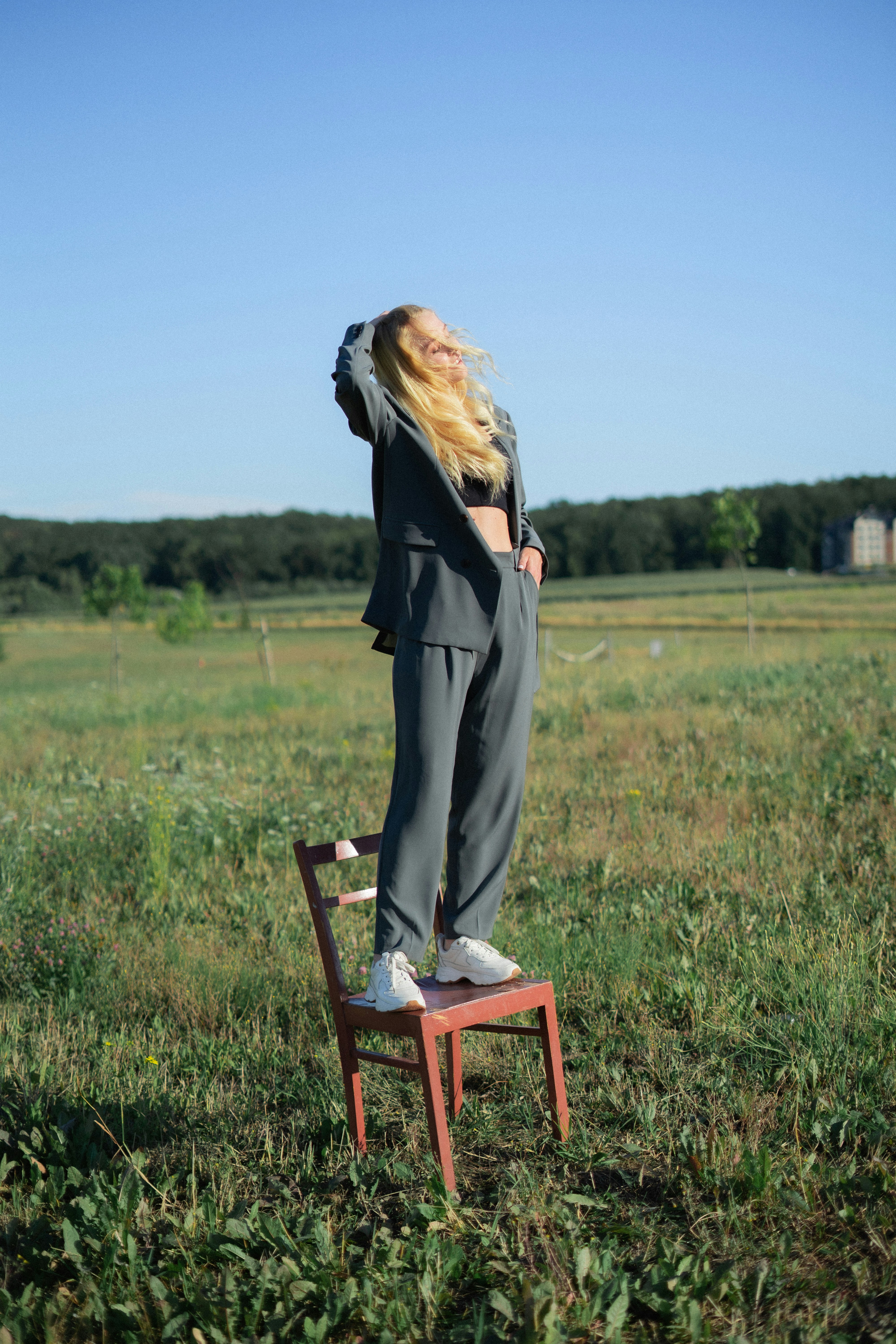 a person standing on a stool in a field