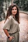 woman with long hair wearing khaki shirt