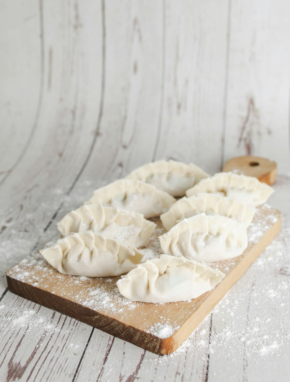 a group of cookies on a cutting board