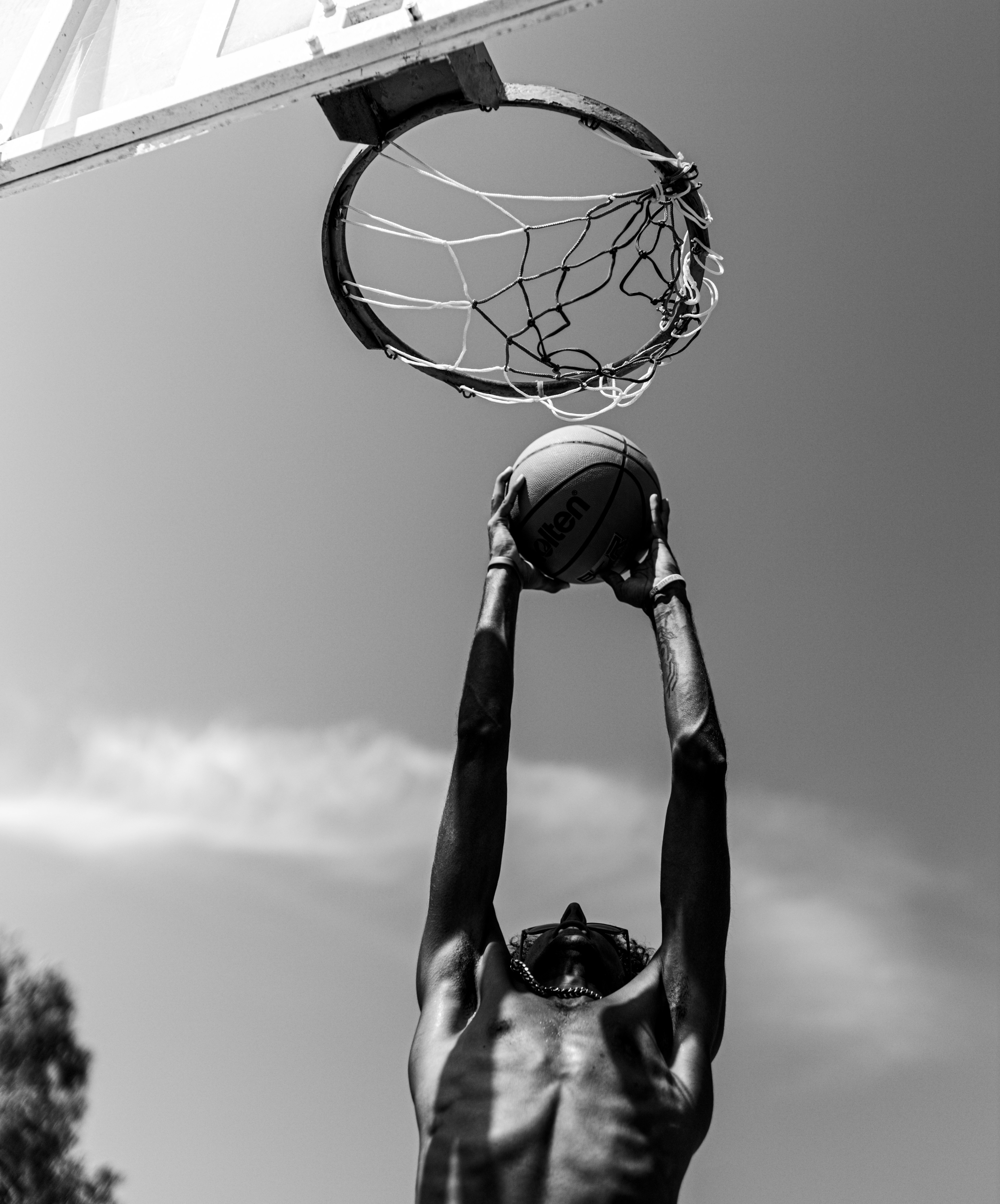 a man dunking a basketball