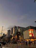 Evening lights illuminating a popular shopping street in downtown Durgapur
