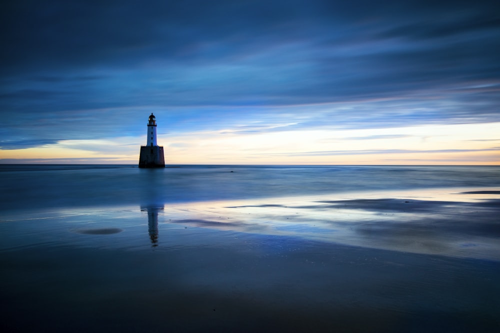 a lighthouse on a beach