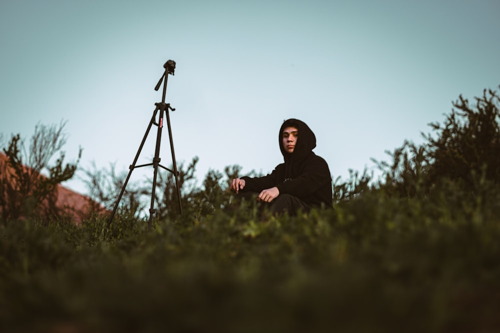 a person sitting in a field