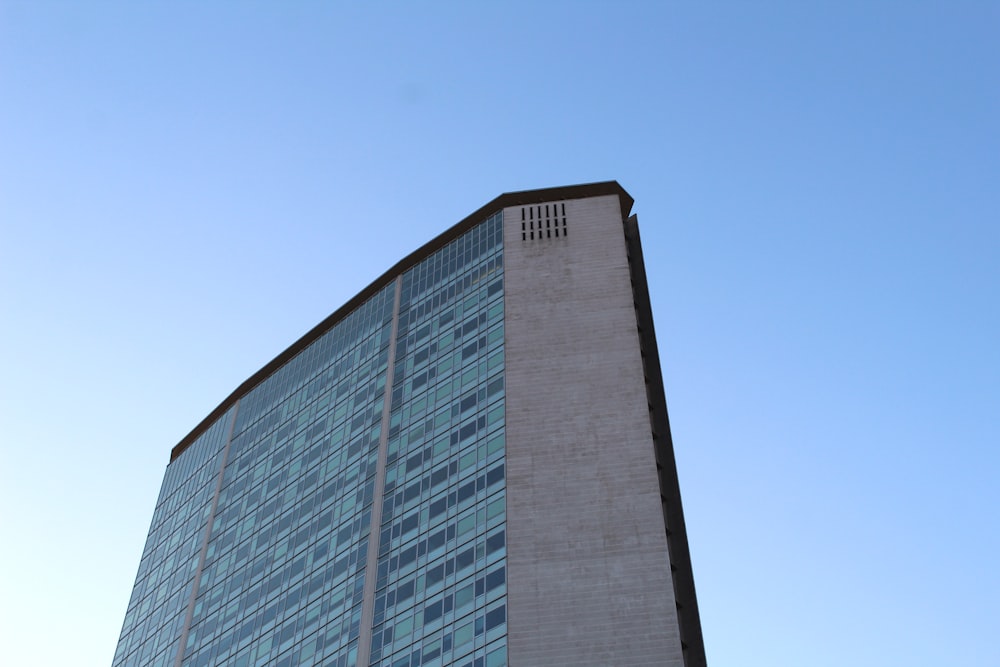 a tall building with a blue sky