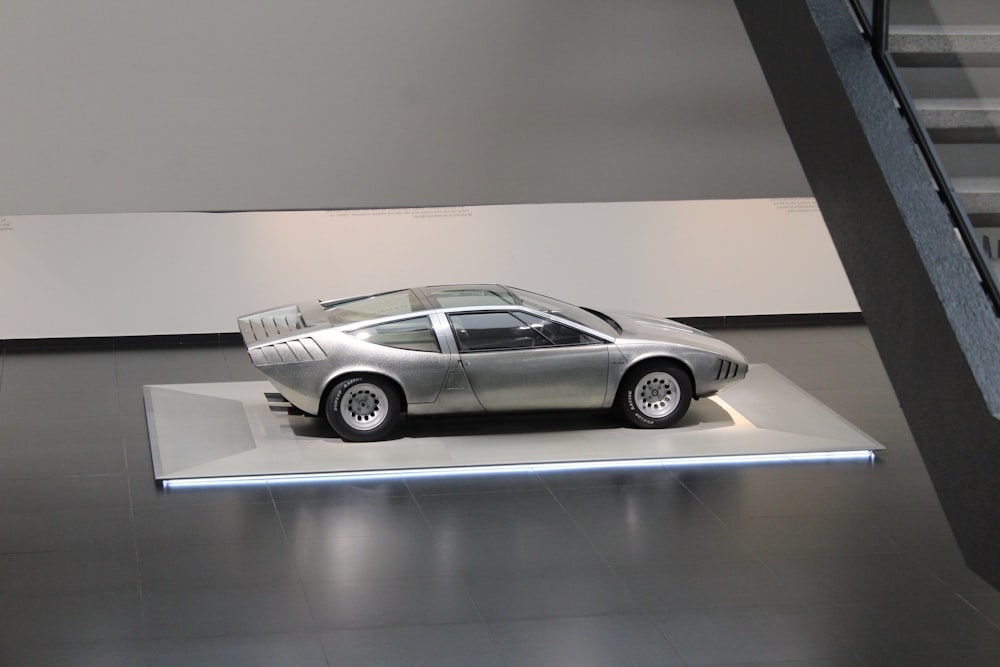 a silver car parked in a building