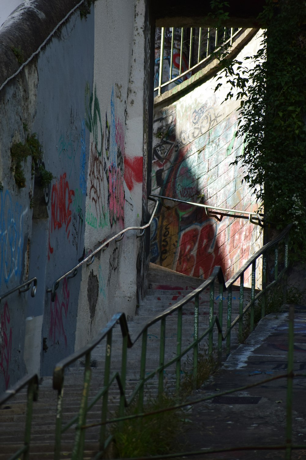 a stairway with graffiti on it