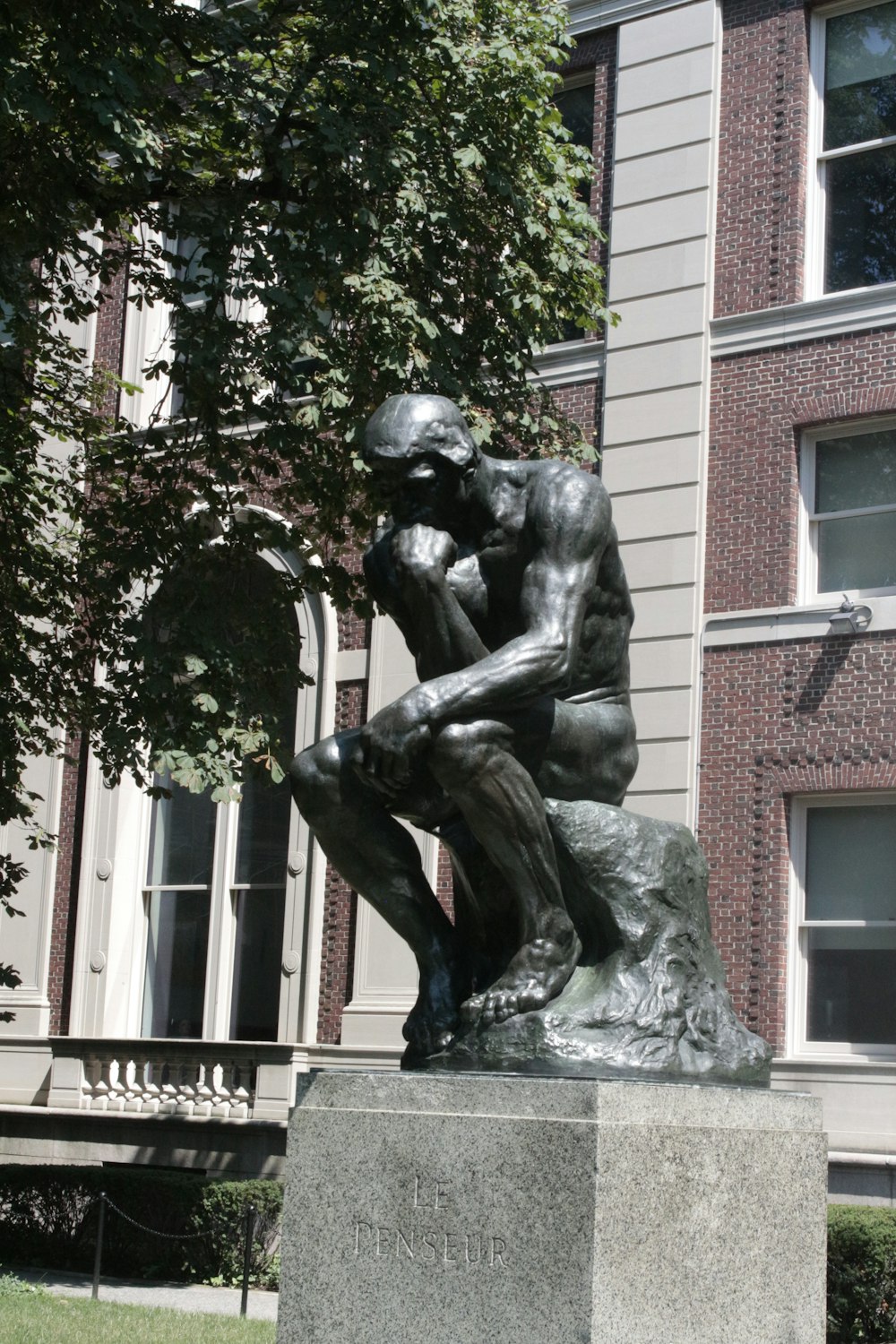 a statue of a man holding a dog