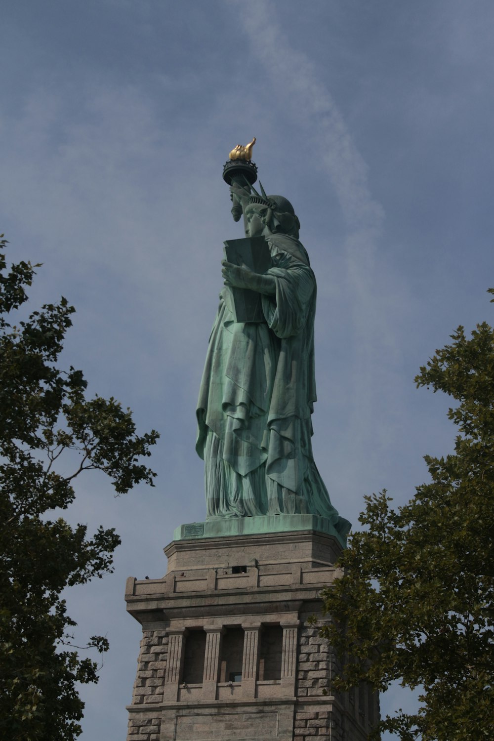a statue of a person holding a torch