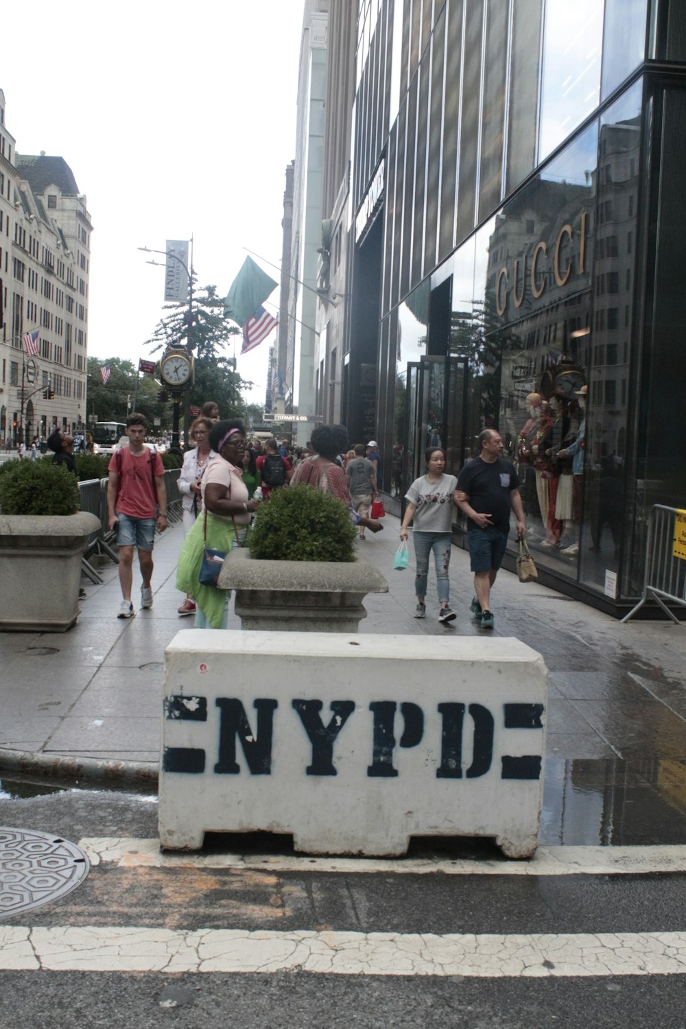 people walking on a sidewalk