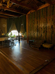 Support staff coordinating logistics with natural wood and green decor around.