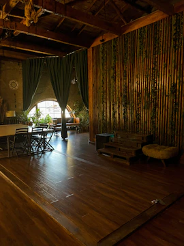 Support staff coordinating logistics with natural wood and green decor around.