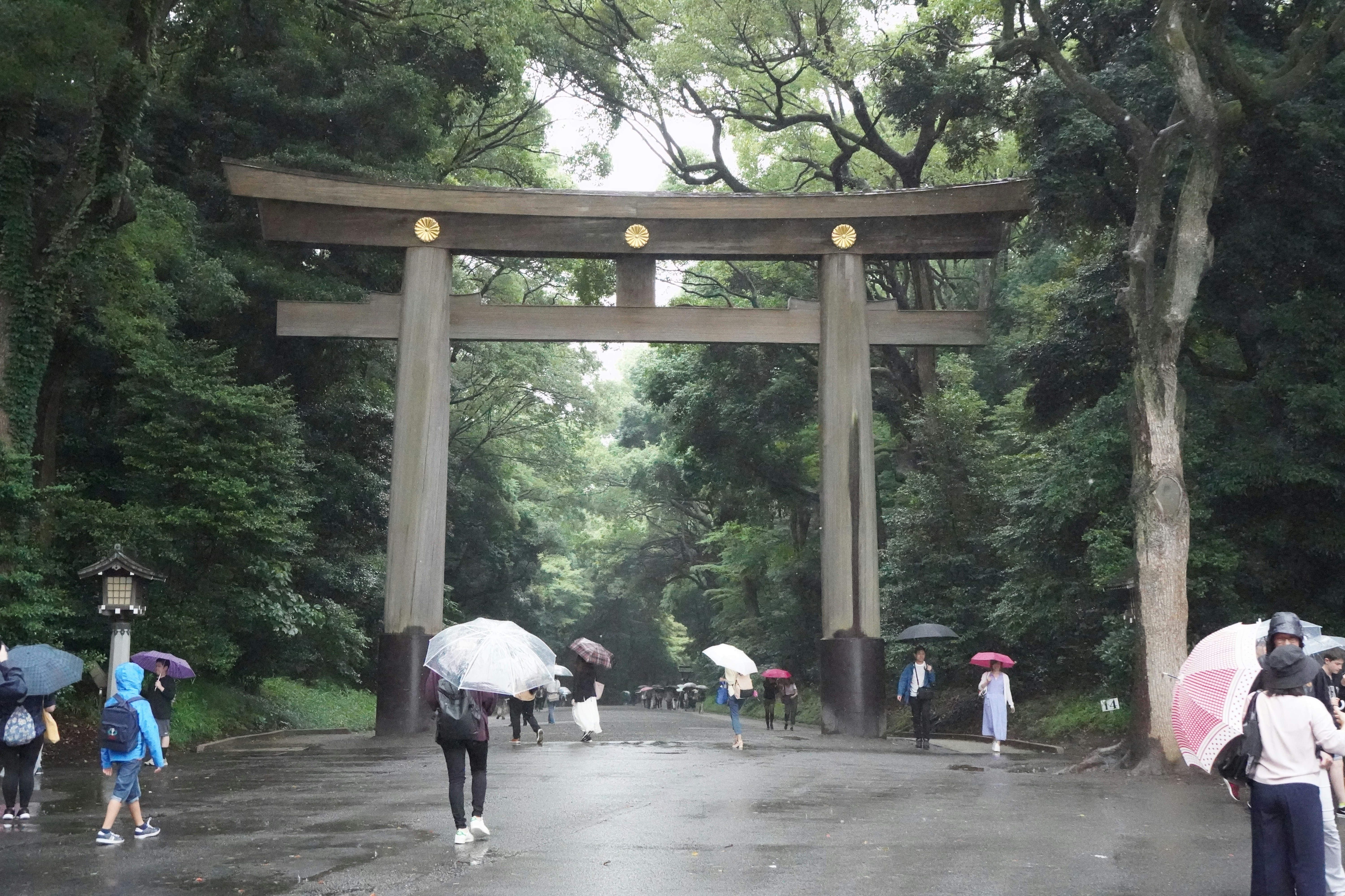 people walking under an arch