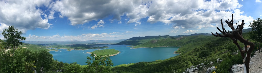 a body of water surrounded by hills