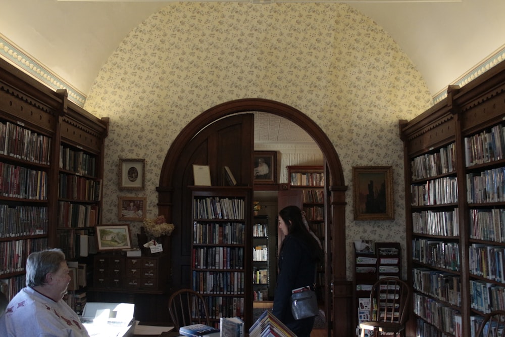 a person standing in a library