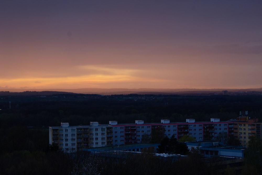 a city with a sunset in the background