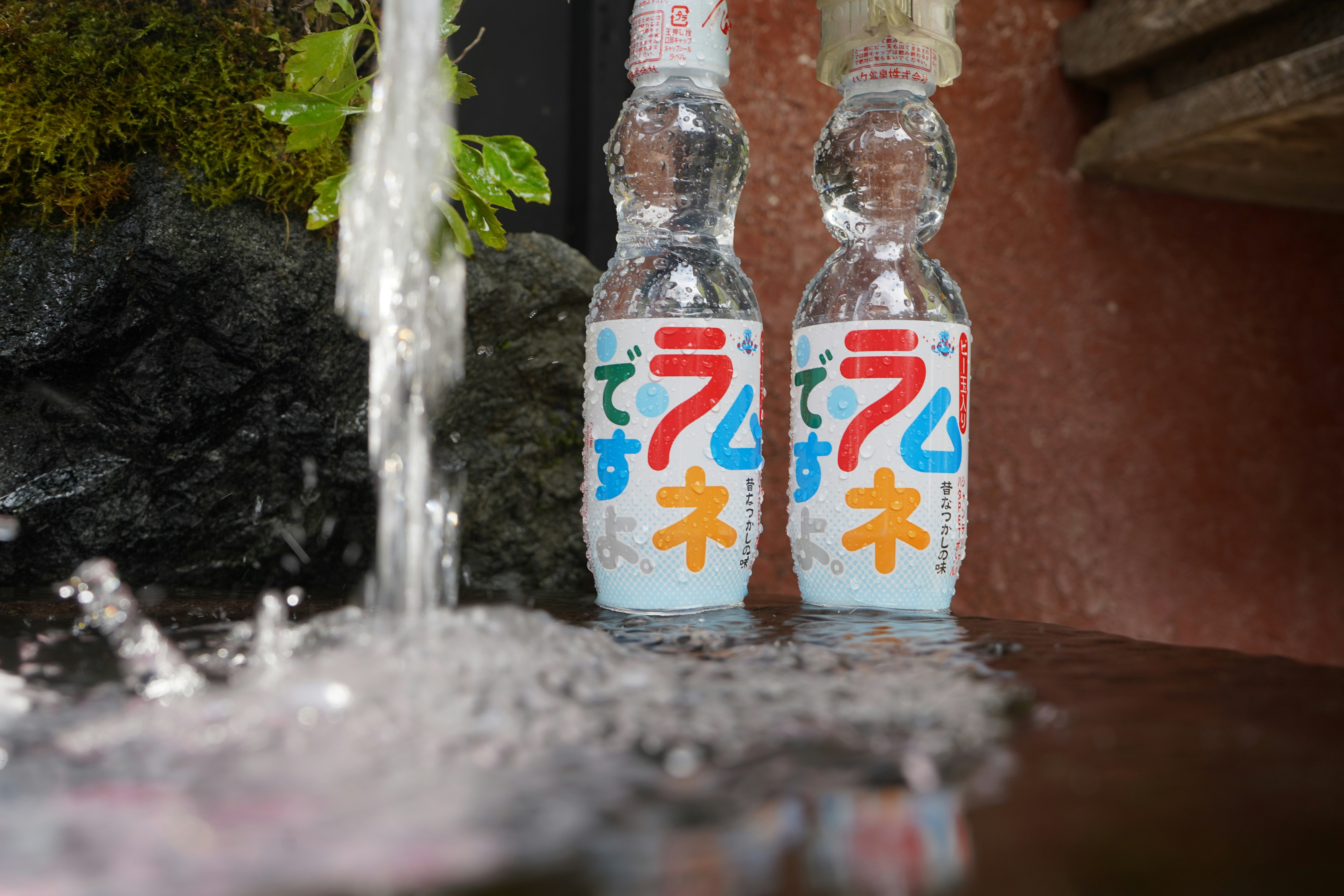two bottles of soda, Ramune drink by the water in Japan