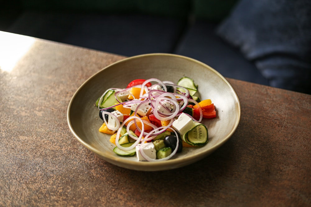 a bowl of food sitting on a table