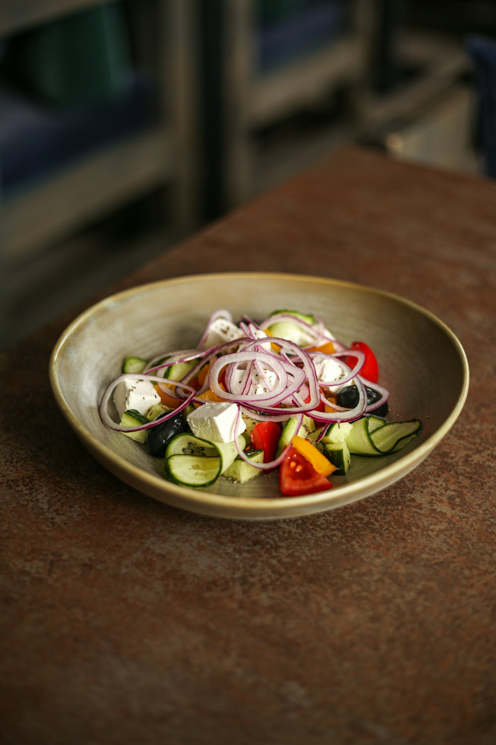 a plate of food sitting on top of a wooden table