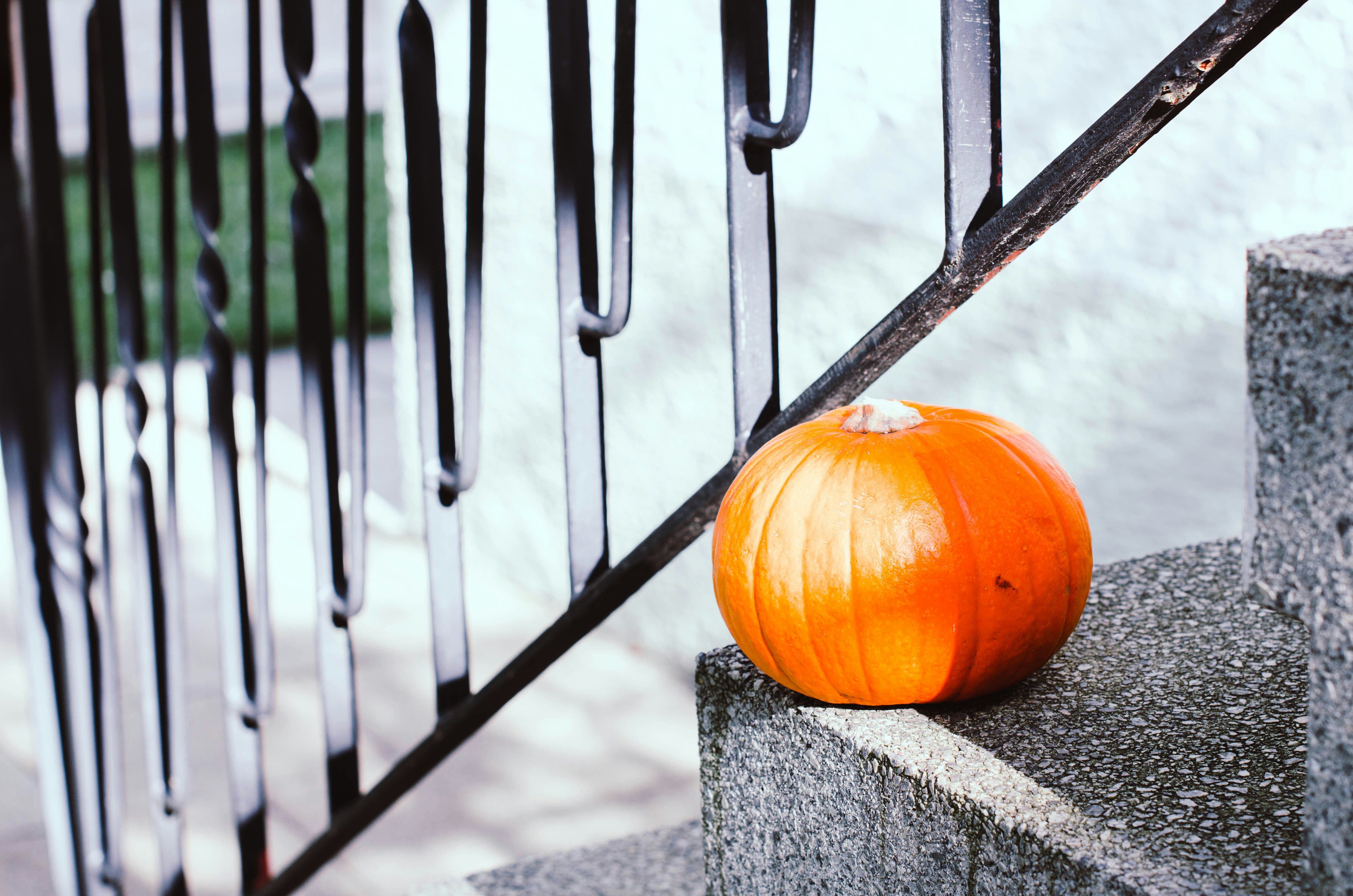 a pumpkin on a stone ledge