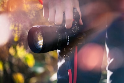 a person holding a camera