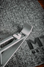 Compact gray foldable tablet stand designed for office use.