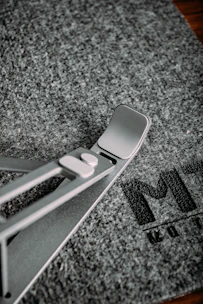 Compact gray foldable tablet stand designed for office use.