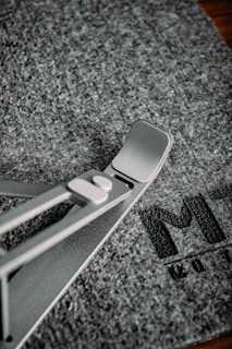 Close-up of a lightweight, foldable portable display stand with clean lines.