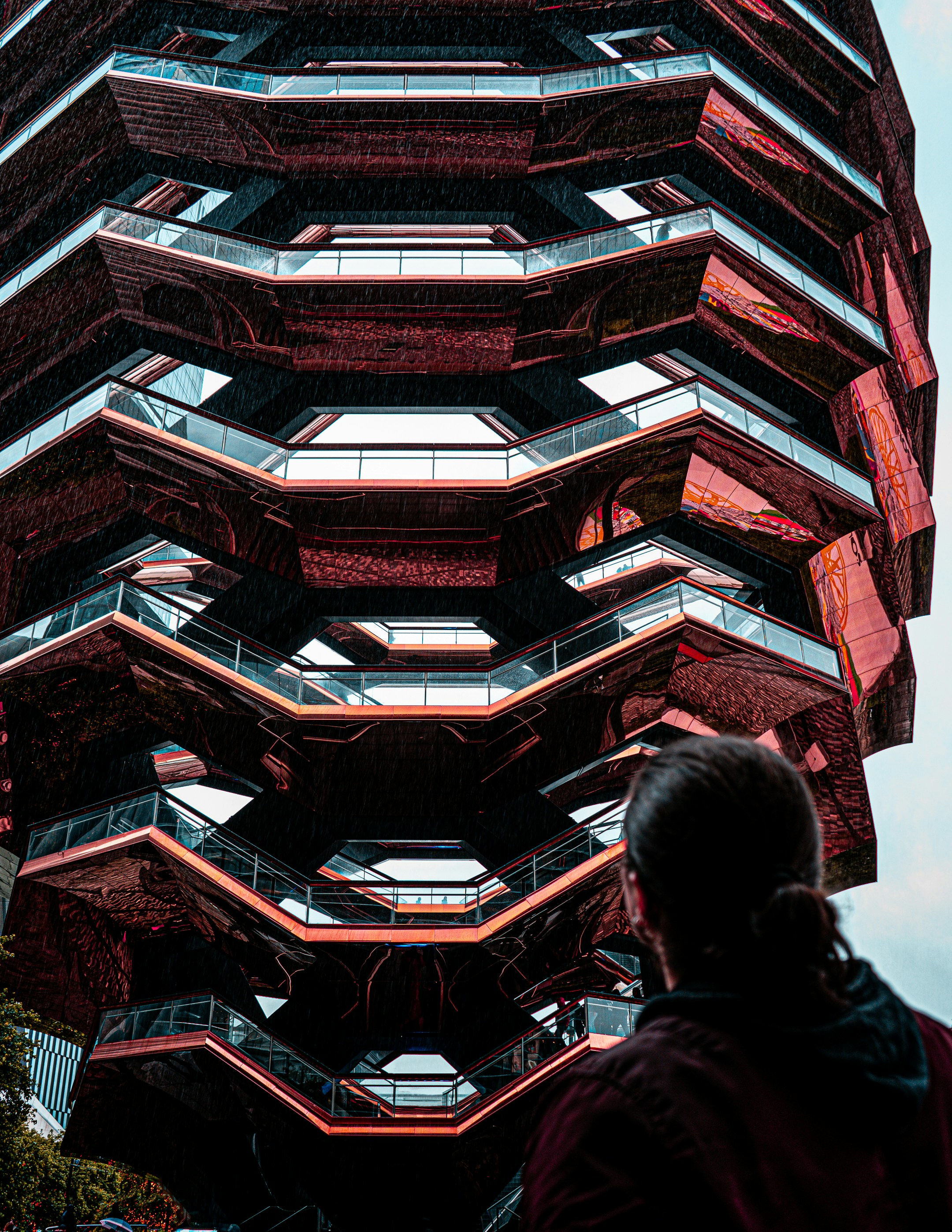 a person looking up at a tall building