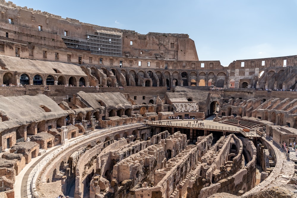 a large ancient building with Colosseum in the background