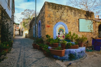 a stone building with a statue in front of it