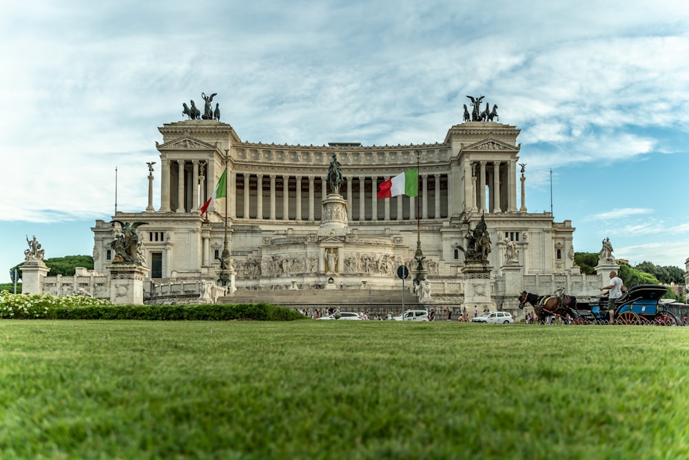 a large building with columns and statues