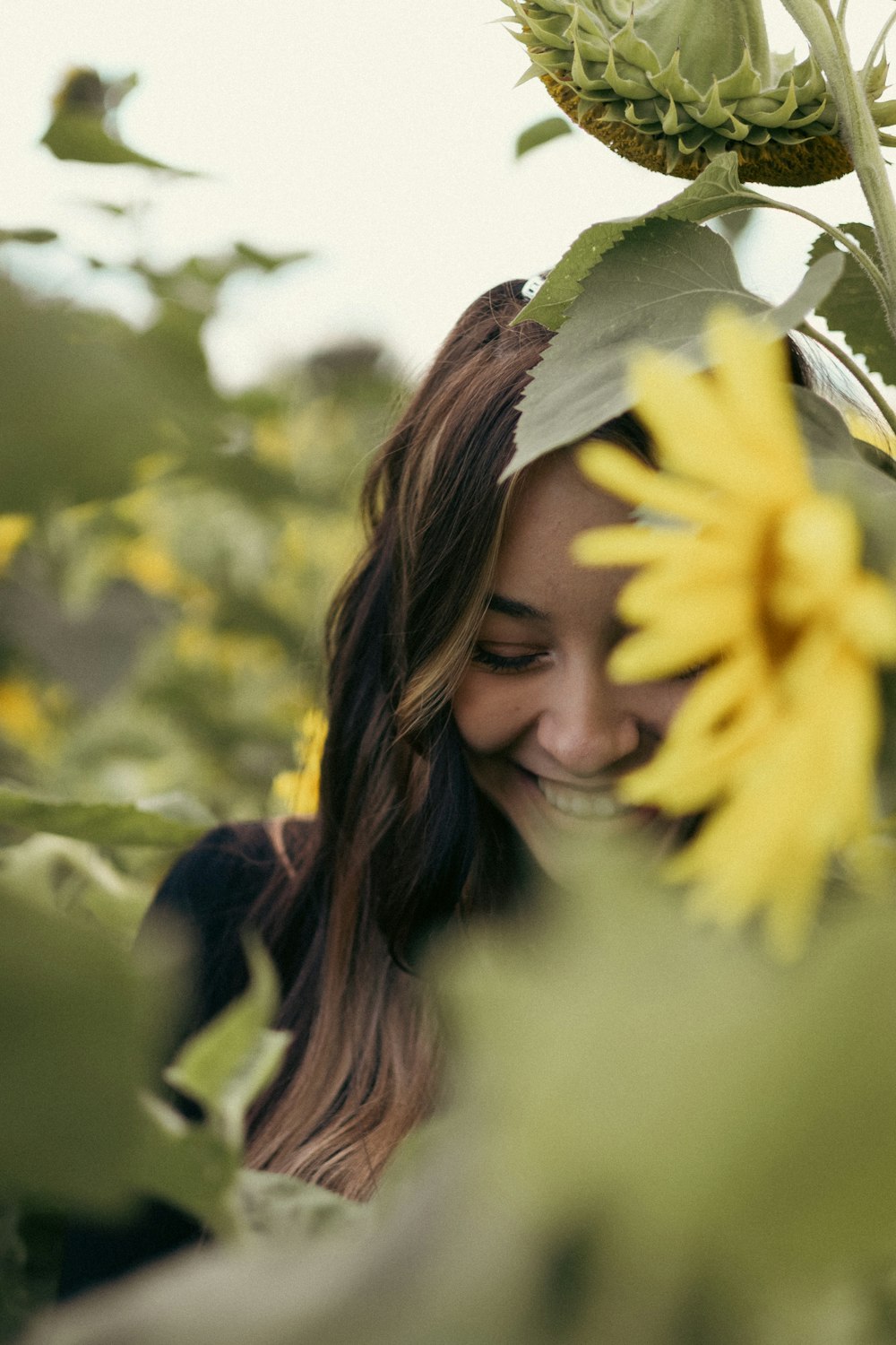 a woman smelling a flower