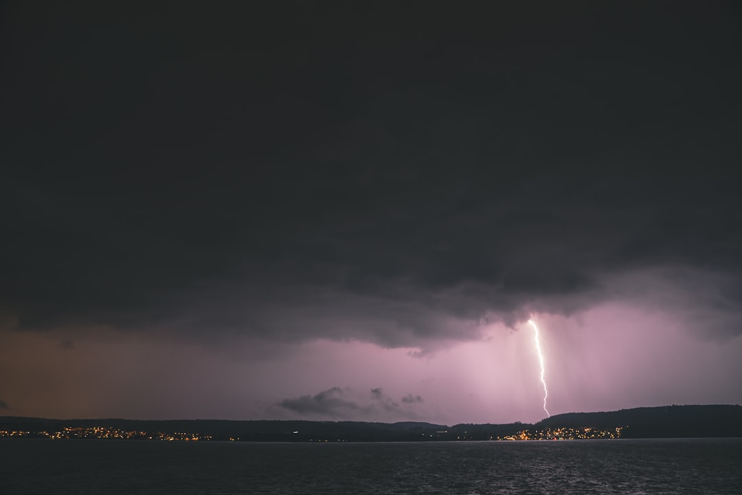 a lightning bolt striking a city,