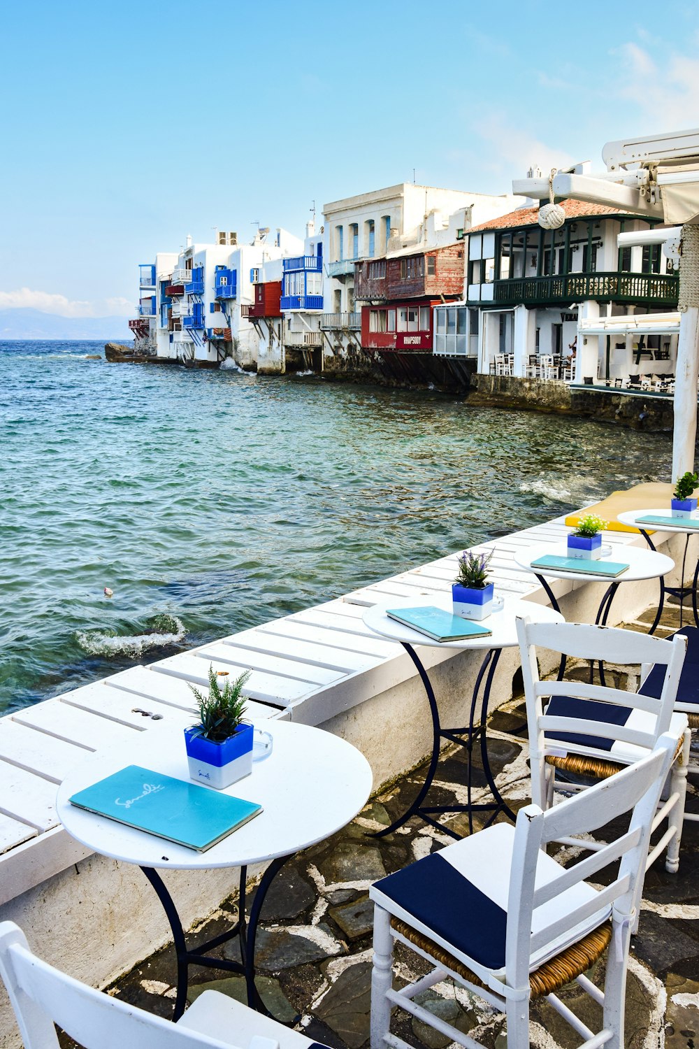 tables and chairs on a deck